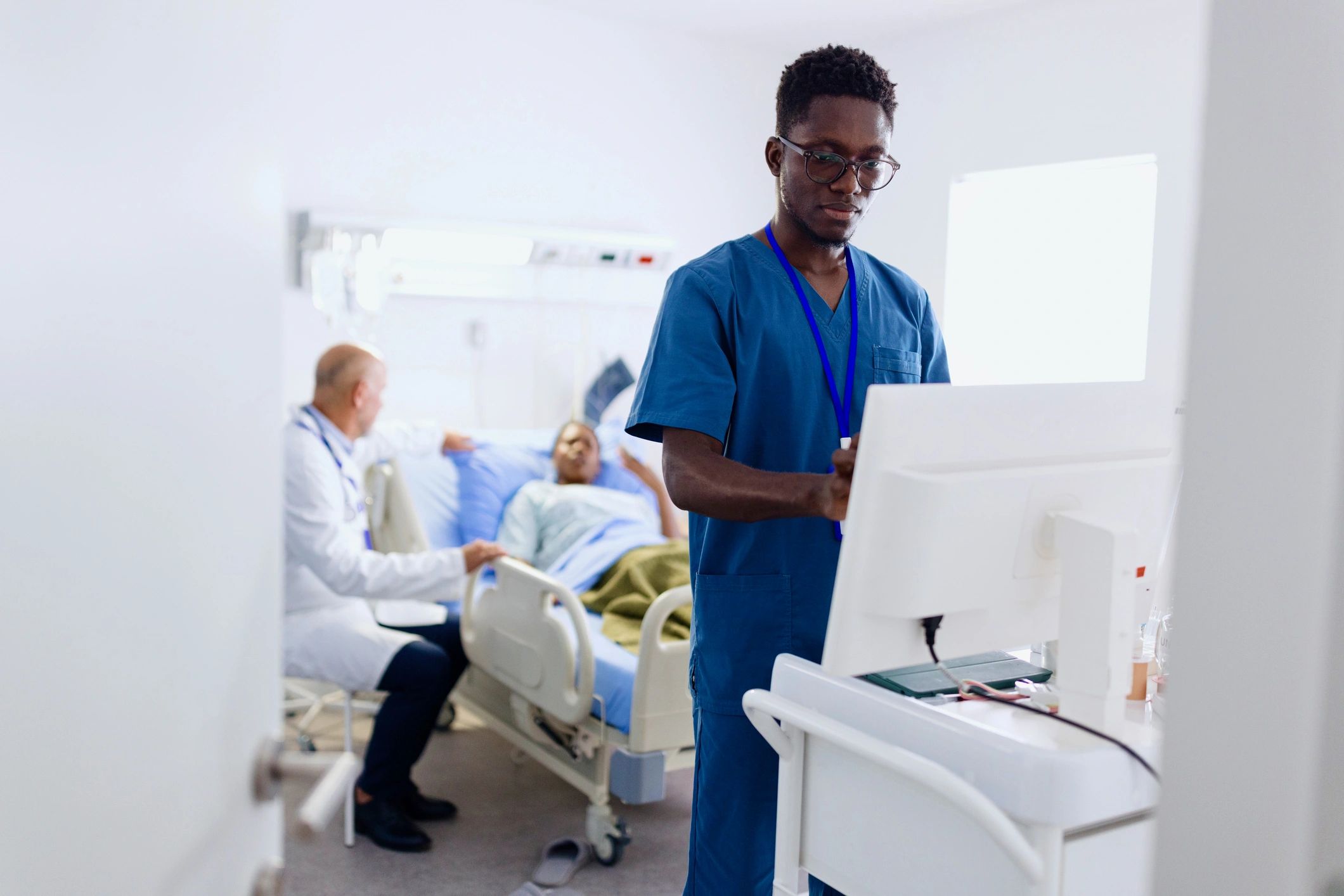 Hospital staff member working on a computer